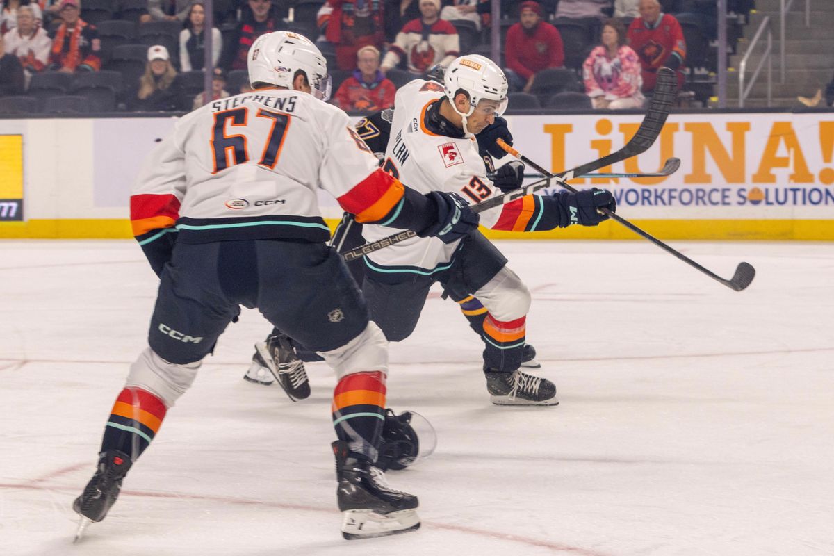 Coachella Valley Firebirds defenseman Lleyton Moore (13) takes a shot toward the net during an AHL hockey game against the Ontario Reign, Sunday, October 11, 2026, in Palm Desert, Calif.