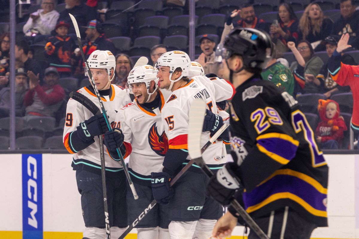Coachella Valley Firebirds forward Lleyton Roed (29) celebrates with teammates after scoring a goal during an AHL hockey game against the Ontario Reign, Sunday, October 11, 2026, in Palm Desert, Calif.