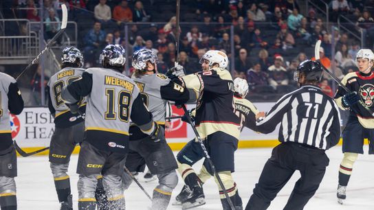 Coachella Valley Firebirds forward Nathan Villeneuve (90) exchanges shoves with Henderson Silver Knights forward Joe Fleming (50) during the second period of an AHL hockey game at Acrisure Arena, Friday, Oct. 30, 2026, in Palm Desert, Calif.