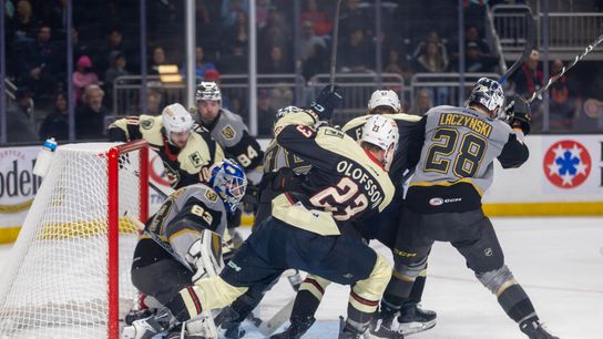 Coachella Valley Firebirds defenseman Gustav Olofsson (23) battles for position in front of Henderson Silver Knights goaltender Pavel Moysevich (83) during the second period of an AHL hockey game at Acrisure Arena, Friday, Oct. 30, 2026, in Palm Desert, Calif.