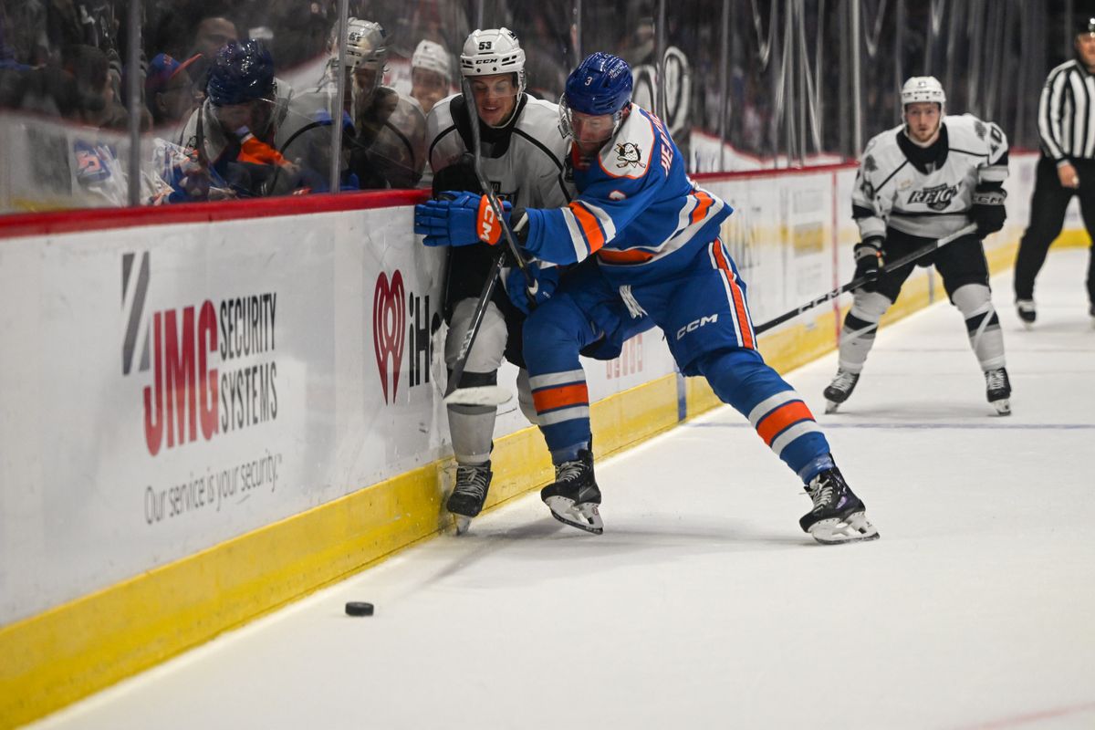 San Diego Gulls defenseman Dillon Heatherington (3) checks Ontario Reign forward Jack Studnicka (53) during an AHL hockey game, Friday, December 27, 2024 in San Diego, Calif.