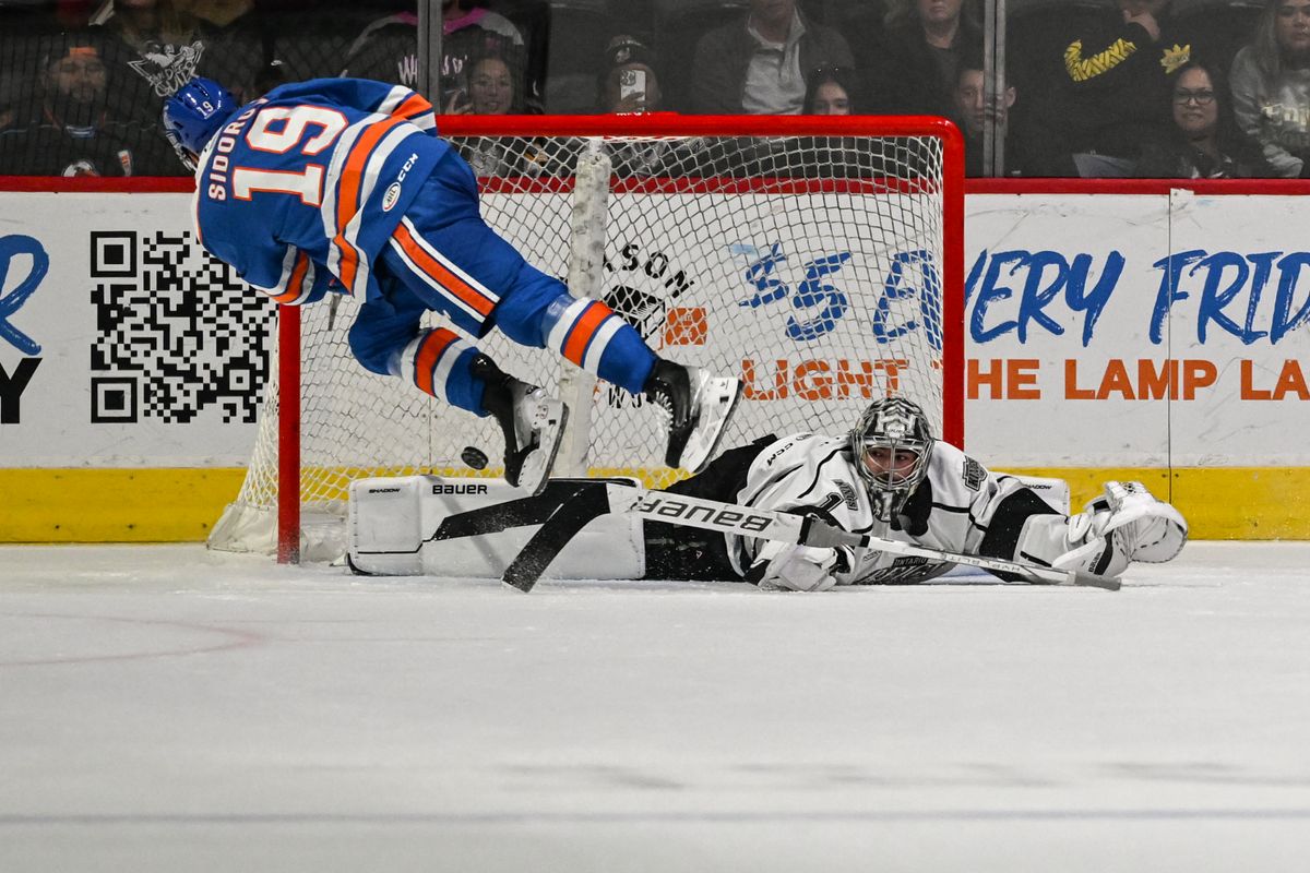 San Diego Gulls right winger Yegor Sidorov (19) scores the game winning shootout goal against Ontario Reign goalie Erik Portillo (1) during an AHL hockey game, Friday, December 27, 2024 in San Diego, Calif.
