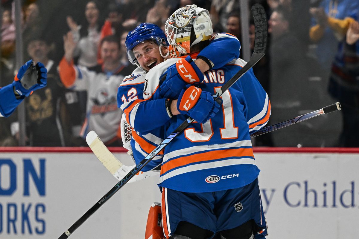 San Diego Goals left winger Pavol Regenda (12) and goalie Calle Clang (31) celebrate after defeating the Ontario Reign 4-3 (shootout) in an AHL hockey game, Friday, December 27, 2024 in San Diego, Calif.