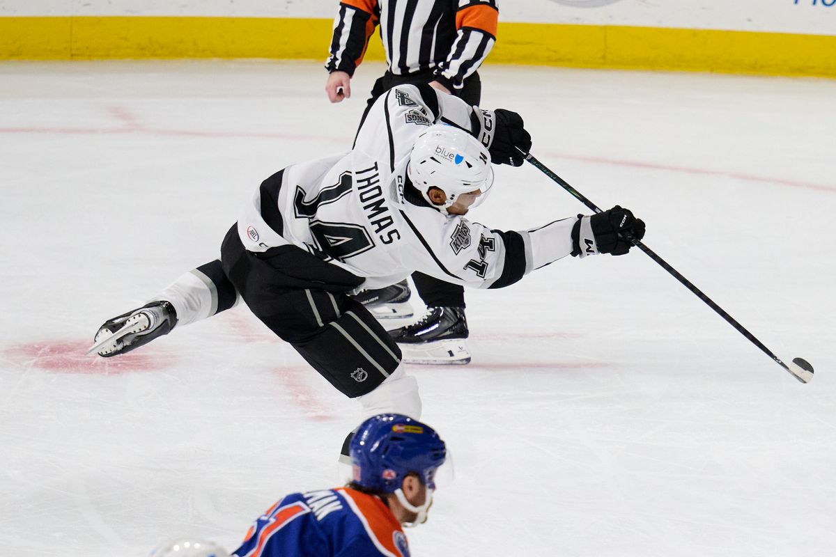 Ontario reign forward Akil Thomas (14) shoots a goal attempt during an AHL hockey game against the Bakersfield Condors, Friday November 21, 2025 in Ontario, Calif.