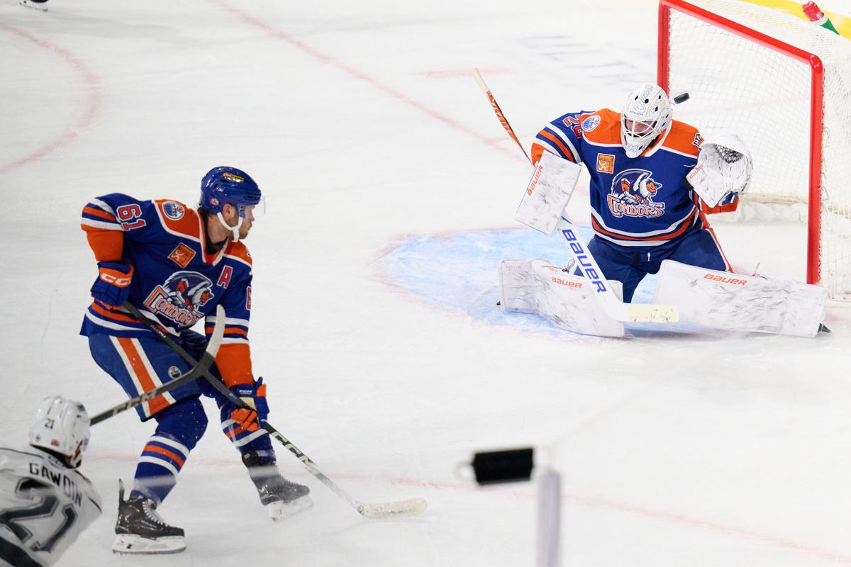 Ontario reign forward Glenn Gawdin (21) shoots a goal attempt during an AHL hockey game against the Bakersfield Condors, Friday November 21, 2025 in Ontario, Calif.