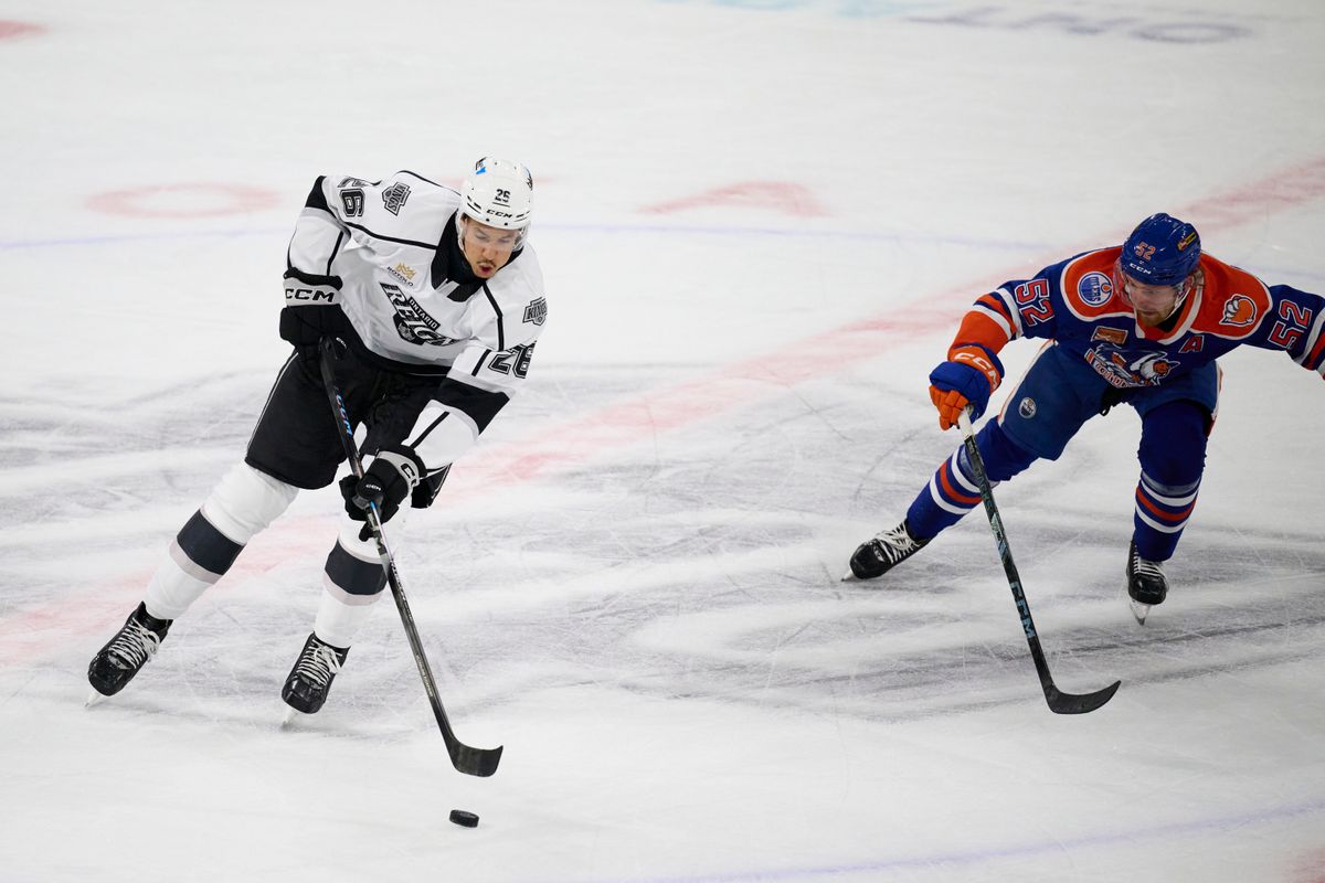 Ontario reign forward Andre Lee (26) gains possession during an AHL hockey game against the Bakersfield Condors, Friday November 21, 2025 in Ontario, Calif.