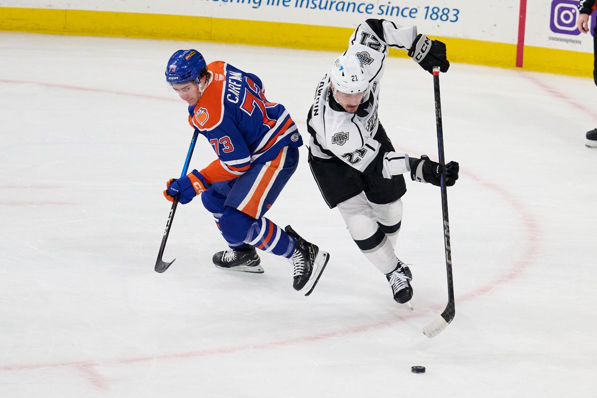 Ontario reign forward Glenn Gawdin (21) gains possession during an AHL hockey game against the Bakersfield Condors, Friday November 21, 2025 in Ontario, Calif.