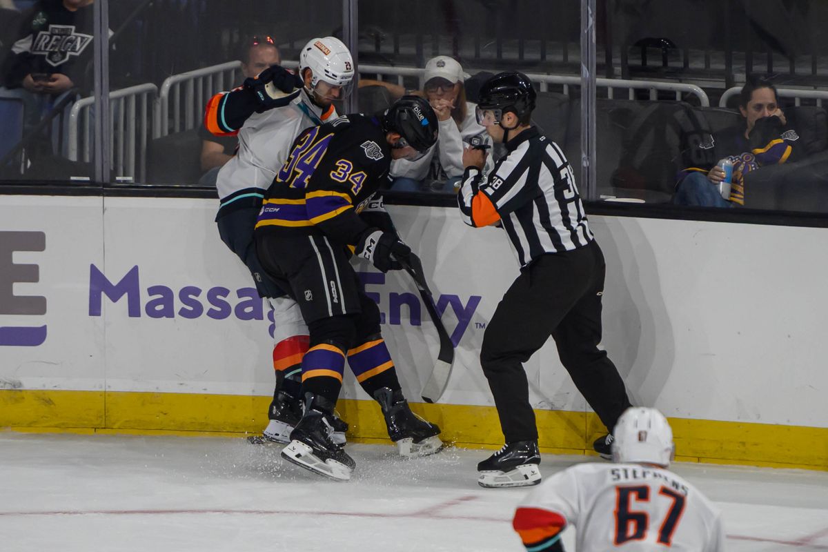 Ontario Reign forward Taylor Ward (34) battles for the puck during an AHL hockey game against Coachella Valley Firebirds, Saturday, Oct. 3, 2026, in Ontario, California. Ontario Reign forward Taylor Ward (34) battles for the puck during an AHL hockey game against Coachella Valley Firebirds, Saturday, Oct. 3, 2026, in Ontario, California.