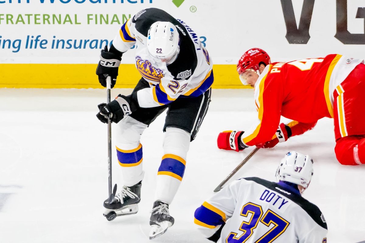 Ontario Reign center Kaleb Lawrence (22) gains control of the puck and attempts to score a goal during an AHL game against the Calgary Wranglers, Tuesday, Oct. 20, 2026, in Ontario, California. Ontario Reign center Kaleb Lawrence (22) gains control of the puck and attempts to score a goal during an AHL game against the Calgary Wranglers, Tuesday, Oct. 20, 2026, in Ontario, California.
