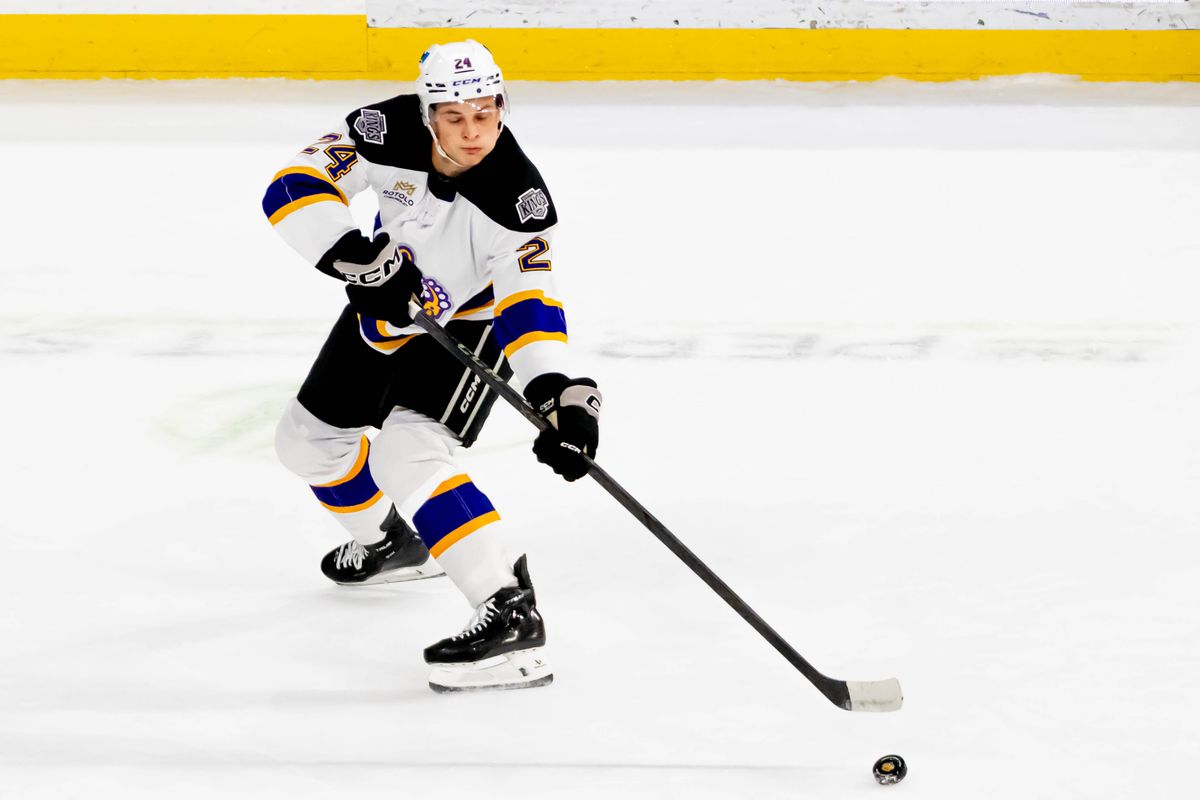 Ontario Reign defender Angus Booth (24) passes the puck during an AHL game on Friday, Oct. 30, 2026, in Ontario, California. Ontario Reign defender Angus Booth (24) passes the puck during an AHL game on Friday, Oct. 30, 2026, in Ontario, California.
