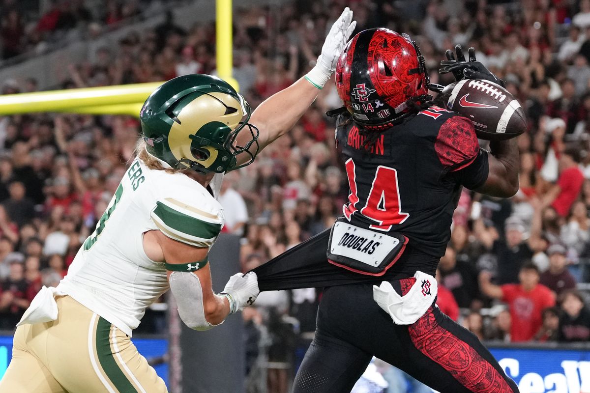 San Diego State University wide receiver Donovan Brown (14) catches the ball during an NCAA football game against Colorado State, Friday October 03, 2025 in San Diego, California.
