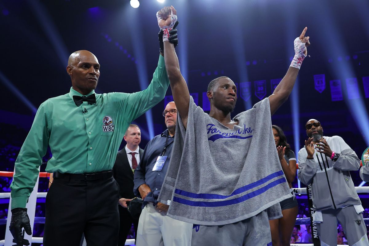 Bruce Carrington has his hand raised after retaining his WBC featherweight title against Rene Palacios. Bruce Carrington has his hand raised after retaining his WBC featherweight title against Rene Palacios.