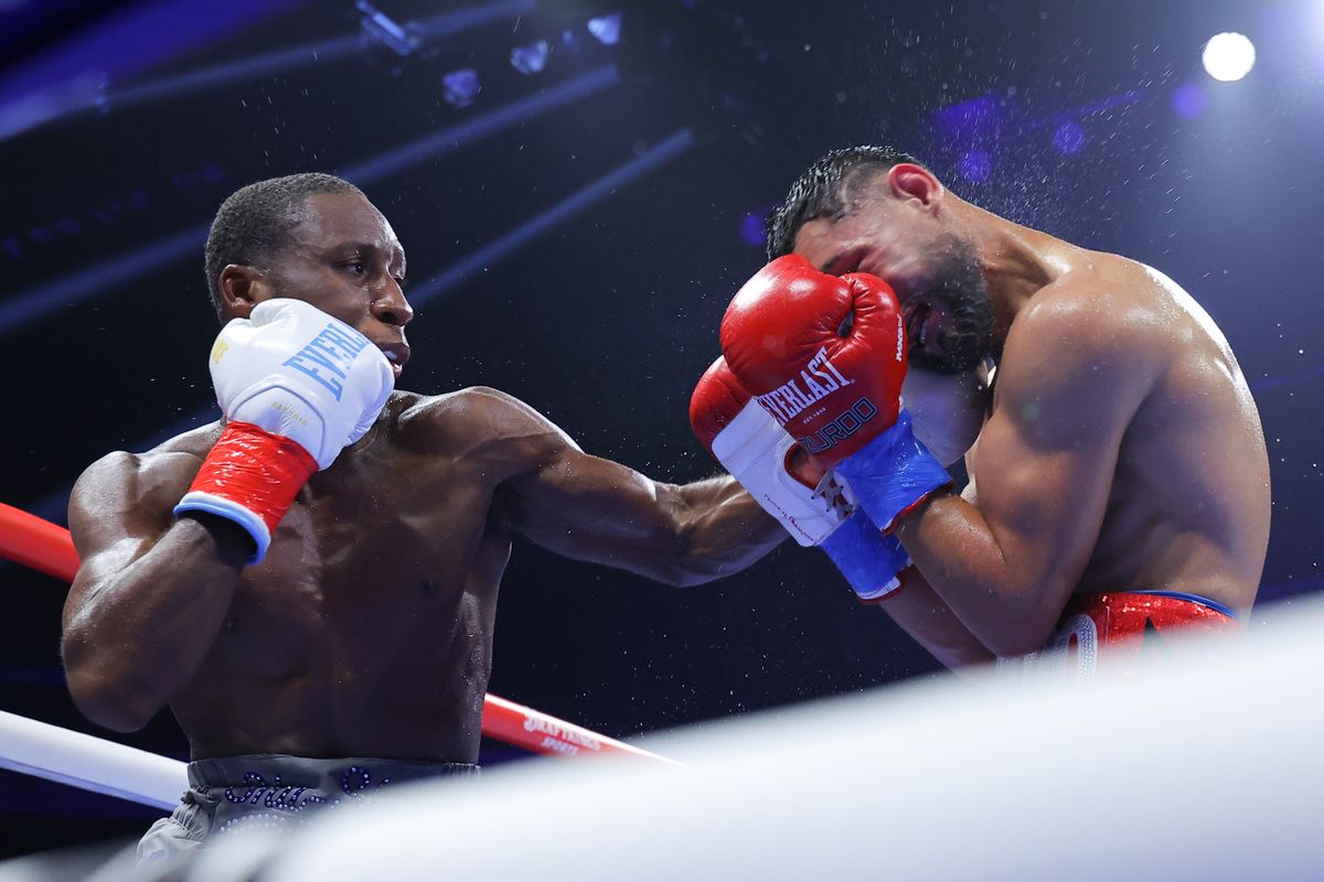 Bruce Carrington lands a left hand on Rene Palacios during their WBC featherweight title fight at Wolstein Center. Bruce Carrington lands a left hand on Rene Palacios during their WBC featherweight title fight at Wolstein Center.