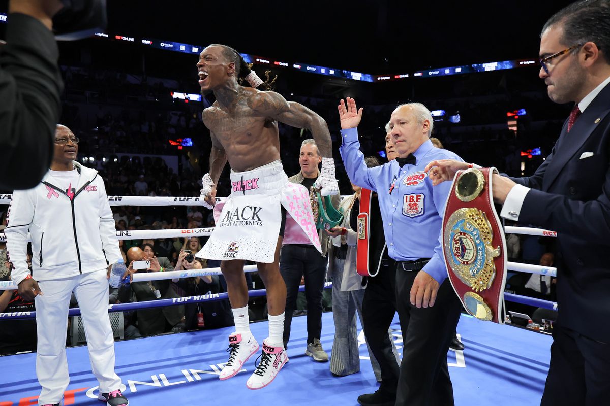 O'Shaquie Foster celebrates the announcement by ring announcer Jimmy Lennon Jr. that he has won by unanimous decision. O'Shaquie Foster celebrates the announcement by ring announcer Jimmy Lennon Jr. that he has won by unanimous decision.