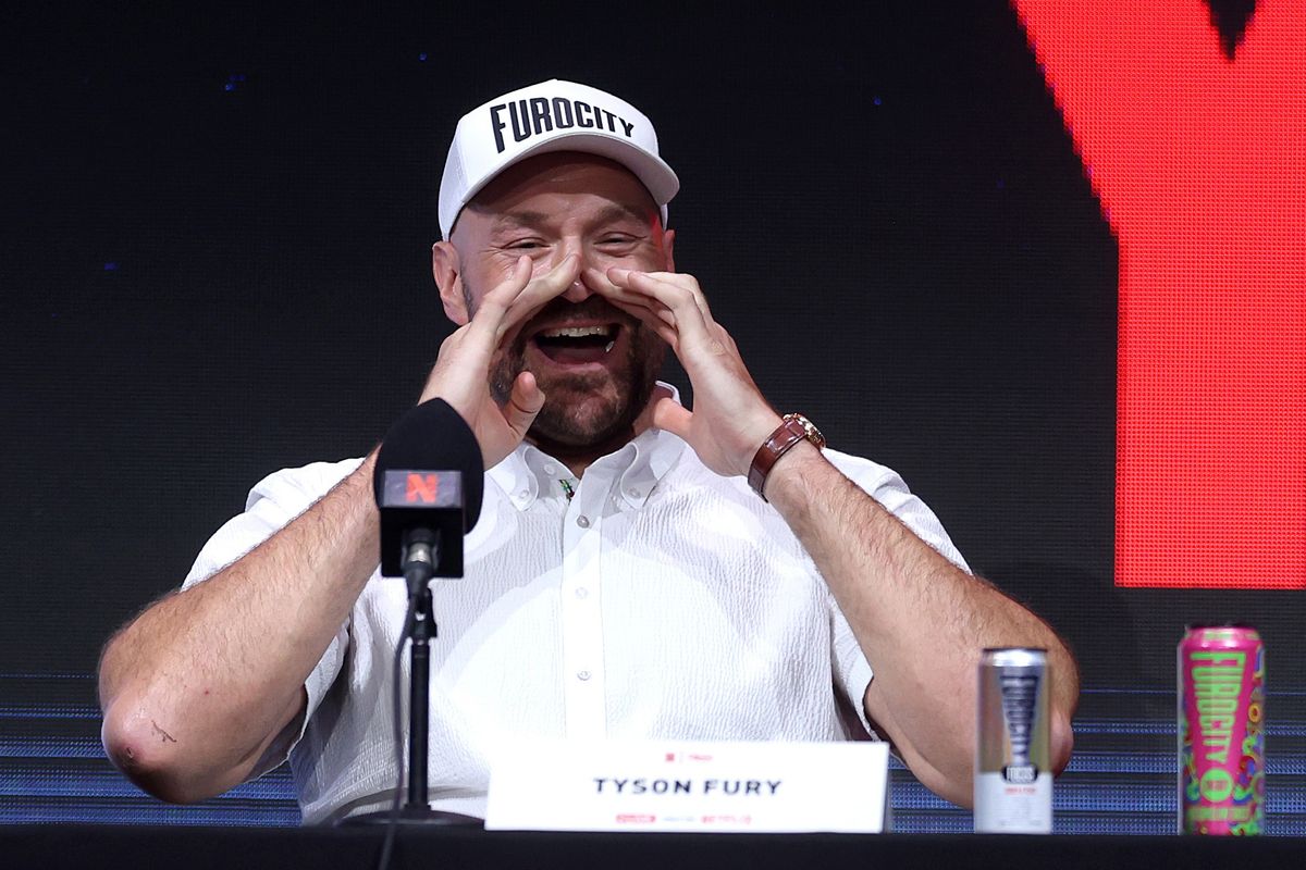Tyson Fury shouts back with the crowd during Wednesday's press conference at Olympia in London. Tyson Fury shouts back with the crowd during Wednesday's press conference at Olympia in London.