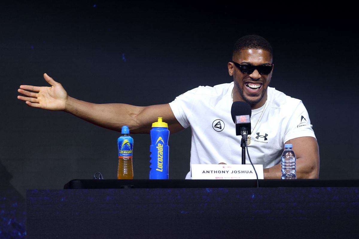 Anthony Joshua gestures toward Tyson Fury during Wednesday's press conference at Olympia in London. Anthony Joshua gestures toward Tyson Fury during Wednesday's press conference at Olympia in London.