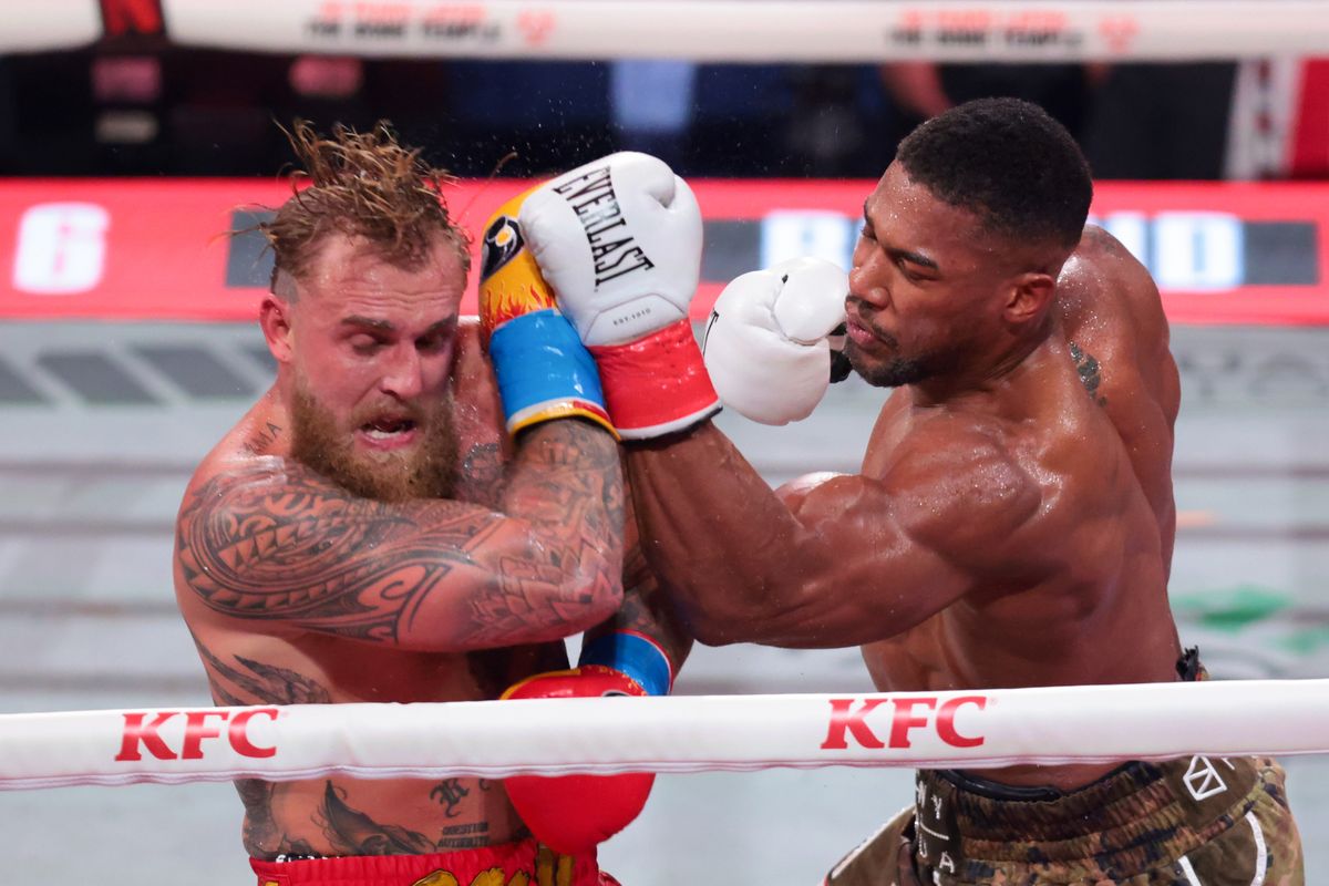 Dec 19, 2025; Miami, Florida, UNITED STATES; Anthony Joshua hits Jake Paul during a heavyweight boxing bout at Kaseya Center. Mandatory Credit: Sam Navarro-Imagn Images Dec 19, 2025; Miami, Florida, UNITED STATES; Anthony Joshua hits Jake Paul during a heavyweight boxing bout at Kaseya Center. Mandatory Credit: Sam Navarro-Imagn Images