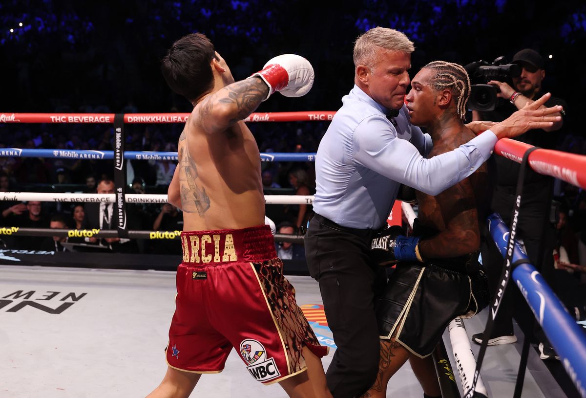 Referee Thomas Taylor steps in to stop the fight between Ryan Garcia and Conor Benn in the second round Saturday at T-Mobile Arena. Referee Thomas Taylor steps in to stop the fight between Ryan Garcia and Conor Benn in the second round Saturday at T-Mobile Arena.
