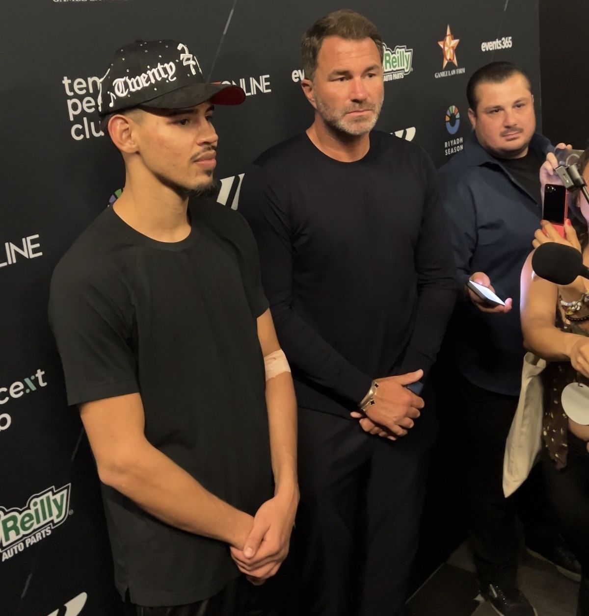 Pacheco stands alongside promoter Eddie Hearn at Friday's post-fight press conference. Pacheco stands alongside promoter Eddie Hearn at Friday's post-fight press conference.