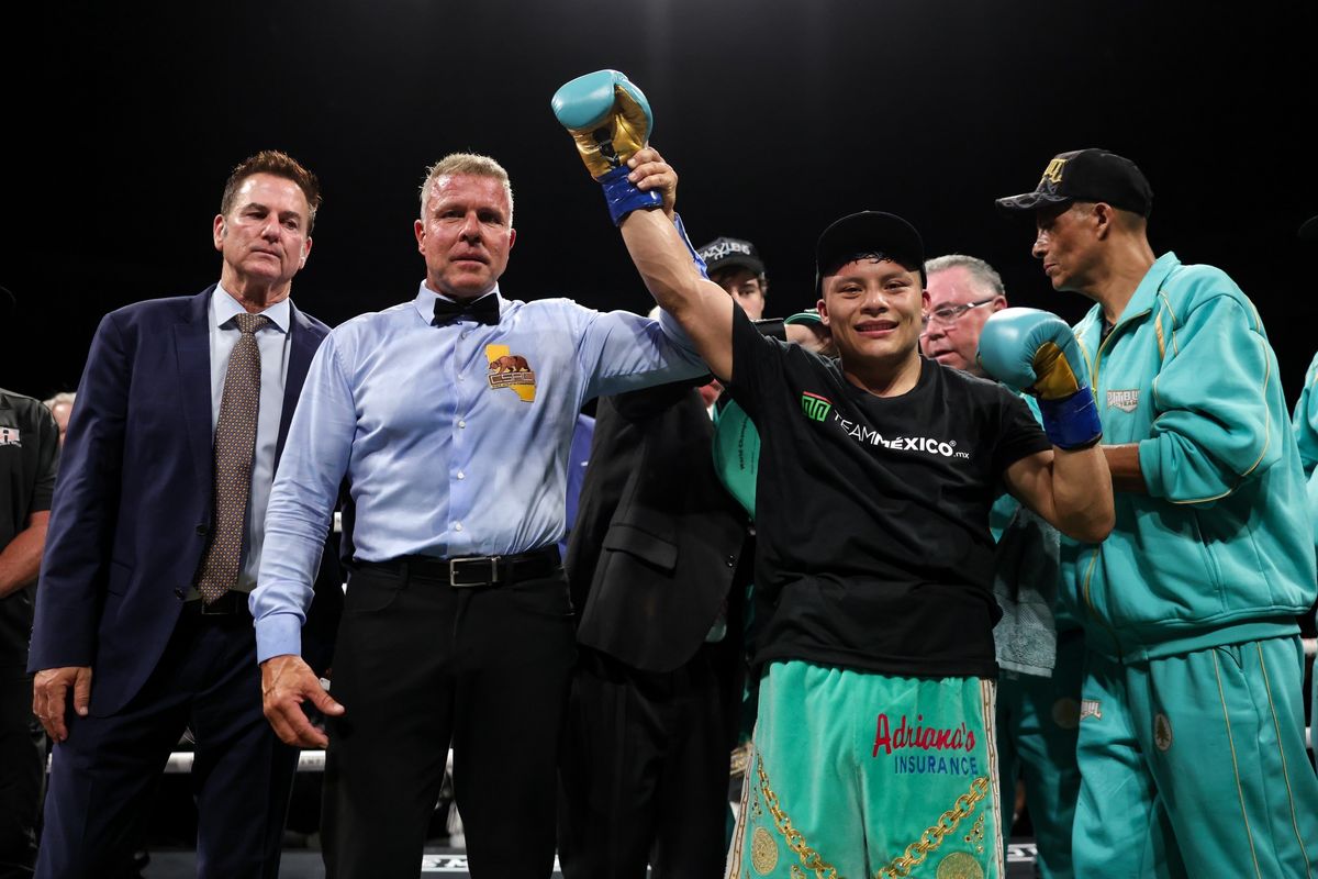 Isaac “Pitbull” Cruz has his hand raised after stopping Nestor Bravo to retain his Interim WBC Super Lightweight Title. Isaac “Pitbull” Cruz has his hand raised after stopping Nestor Bravo to retain his Interim WBC Super Lightweight Title.