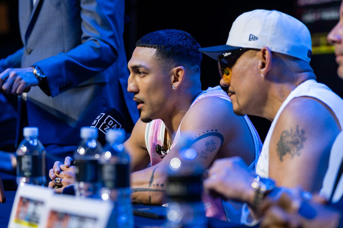 Teofimo Lopez speaks with his father and trainer, Teofimo Lopez Sr., during Thursday's press conference