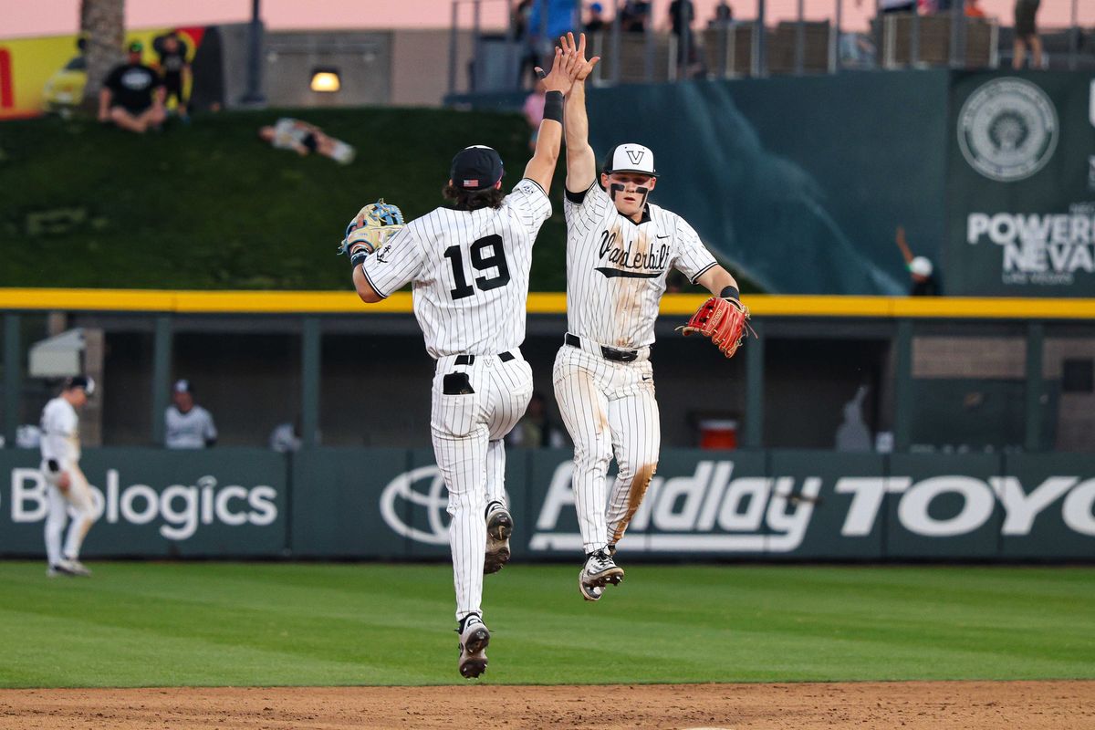 Vanderbilt Commodores LF Rustan Rigdon (19) and Vanderbilt Commodores SS Ryker Waite (51) high five prior to the start of an inning against the Arizona Wildcats at the 2026 Live Like Lou Las Vegas College Baseball Classic on Saturday, February 28, 2026, at Las Vegas Ballpark in Las Vegas, Nevada. 