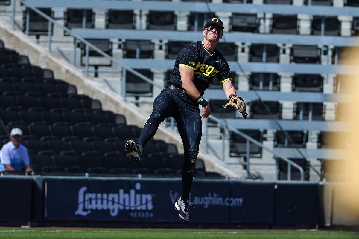 Potential first round pick Oregon Ducks SS Maddox Molony (9) makes a leaping throw for an out against the Vanderbilt Commodores at the 2026 Live Like Lou Las Vegas College Baseball Classic on Sunday, March 1, 2026 at Las Vegas Ballpark in Las Vegas, Nevada. 