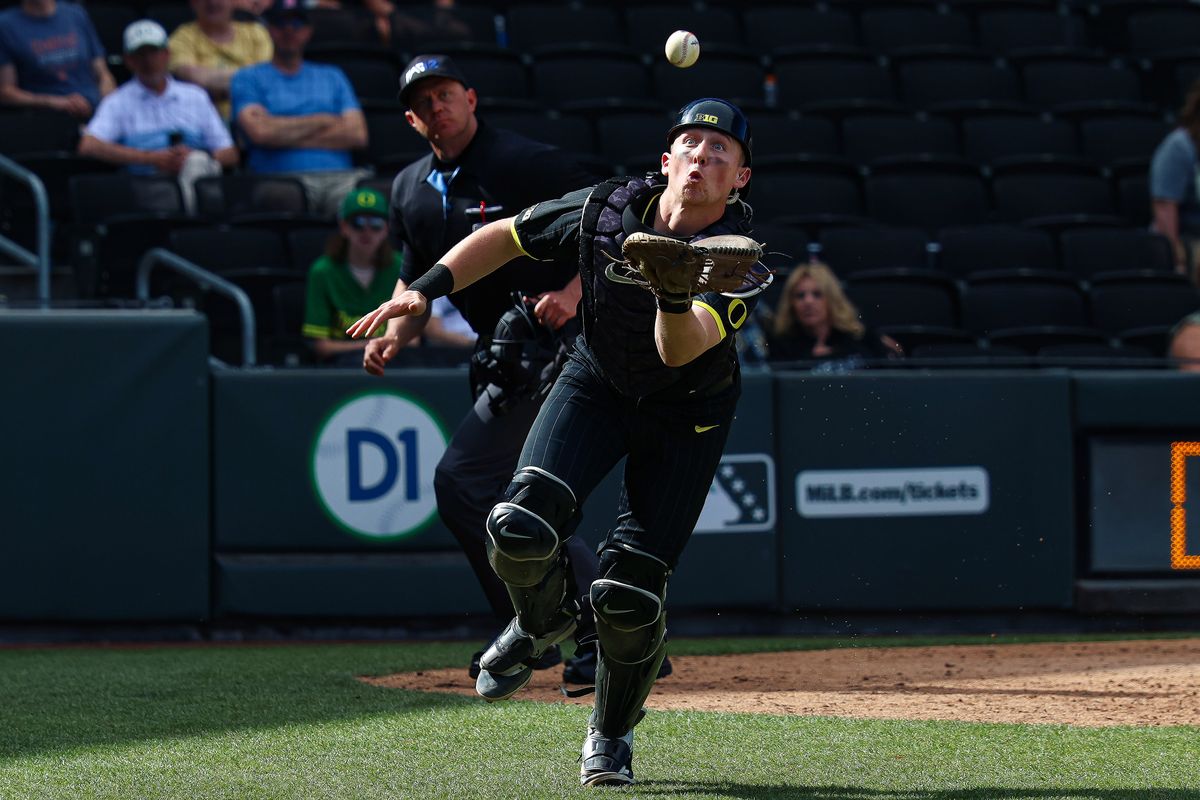 Oregon Ducks C Burke-Lee Mabeus (5) watches the ball prior to making a clutch out in the ninth inning of a college baseball game against the Vanderbilt Commodores at the 2026 Live Like Lou Las Vegas College Baseball Classic on Sunday, March 1, 2026 at Las Vegas Ballpark in Las Vegas, Nevada. 
