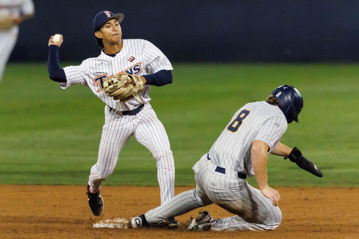 CSUF infielder Eli Lopez (1) attempts to finish the double play during an NCAA Baseball game against the CBU Lancers on February 13, 2026 in Fullerton, California. CSUF infielder Eli Lopez (1) attempts to finish the double play during an NCAA Baseball game against the CBU Lancers on February 13, 2026 in Fullerton, California.