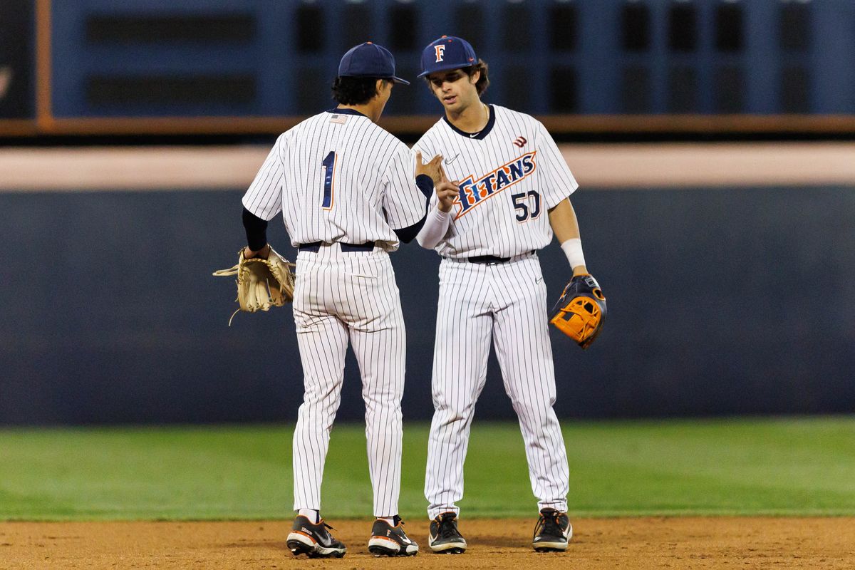 CSUF infielders Eli Lopez (1) and Cade O'Hara (50) shake hands during an NCAA Baseball game against the CBU Lancers on February 13, 2026 in Fullerton, California. CSUF infielders Eli Lopez (1) and Cade O'Hara (50) shake hands during an NCAA Baseball game against the CBU Lancers on February 13, 2026 in Fullerton, California.