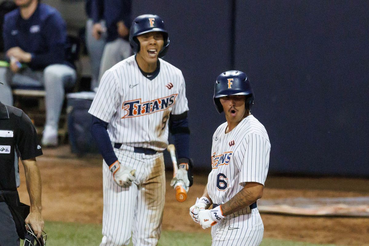 CSUF Titans outfielder Hunter Meyer (6) and infielder Cameron Kim (9) celebrates after scoring a run during an NCAA Baseball game against the CBU Lancers on February 13, 2026 in Fullerton, California. CSUF Titans outfielder Hunter Meyer (6) and infielder Cameron Kim (9) celebrates after scoring a run during an NCAA Baseball game against the CBU Lancers on February 13, 2026 in Fullerton, California.