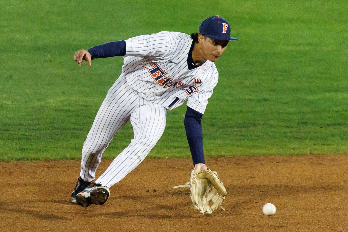 CSUF Titans infielder Eli Lopez (1) fields the ball during an NCAA Baseball game against the CBU Lancers on February 13, 2026 in Fullerton, California. CSUF Titans infielder Eli Lopez (1) fields the ball during an NCAA Baseball game against the CBU Lancers on February 13, 2026 in Fullerton, California.