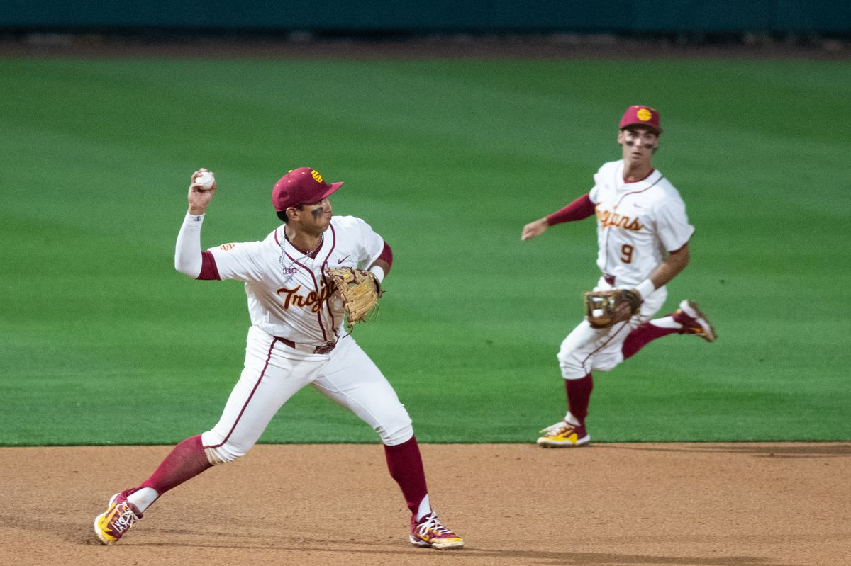 USC Trojan infielder Adrian Lopez (5) throws the ball to second base for an out during an NCAA Men's baseball game between the USC Trojans and Pepperdine Wave Friday February 13,2026 at Dedeaux Field in Los Angeles Calif