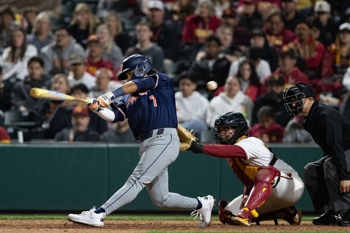 Pepperdine Wave infielder Julian Nunez (7) swings and misses the ball during an NCAA Men's baseball game between the USC Trojans and Pepperdine Wave Friday February 13,2026 at Dedeaux Field in Los Angeles Calif