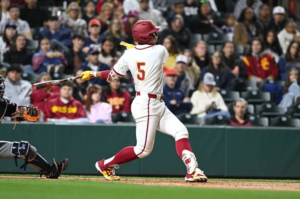 USC Trojan infielder Adrian Lopez (5) swings and misses the ball during an NCAA Men's baseball game between the USC Trojans and Pepperdine Wave Friday February 13,2026 at Dedeaux Field in Los Angeles Calif