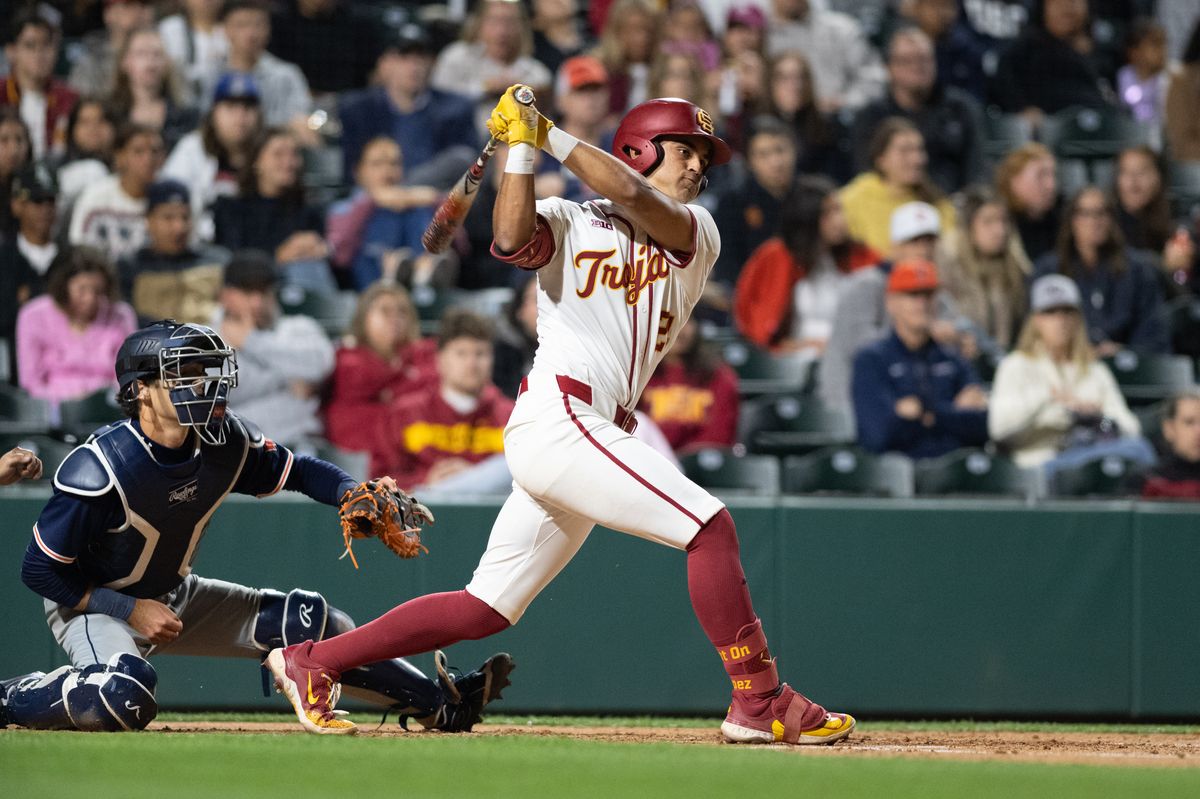 USC Trojan catcher Augie Lopez (5) makes a base hit during an NCAA Men's baseball game between the USC Trojans and Pepperdine Wave Friday February 13,2026 at Dedeaux Field in Los Angeles Calif