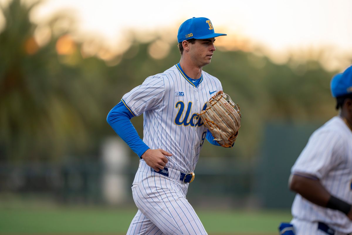 UCLA outfielder, Will Gasparino (9) returning to the dugout between innings during a NCAA baseball game against UC San Diego on February 13, 2026 at Jackie Robinson Stadium in Los Angeles, CA.