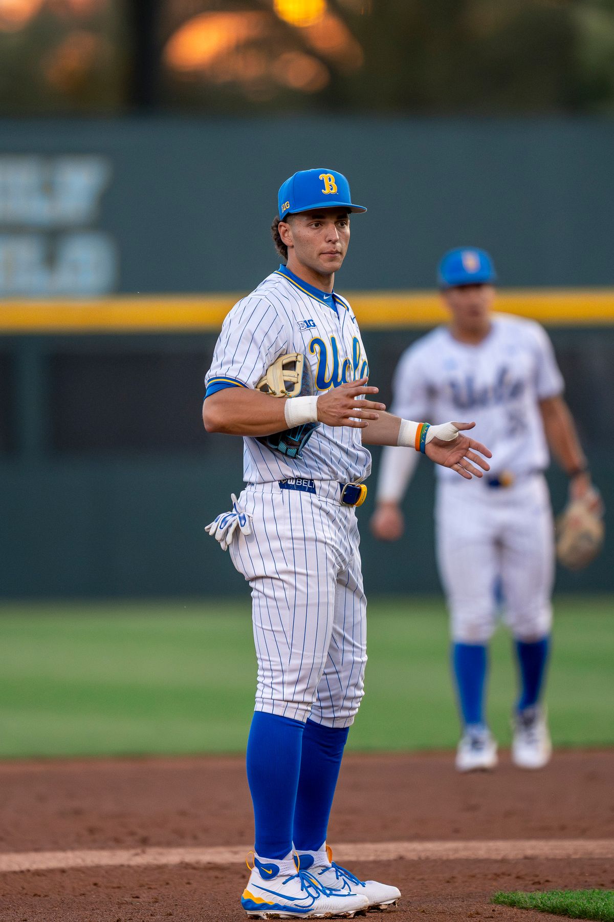 UCLA infielder, Roch Cholowsky, (1) gesturing to teammates during a NCAA baseball game against UC San Diego on February 13, 2026 at Jackie Robinson Stadium in Los Angeles, CA.