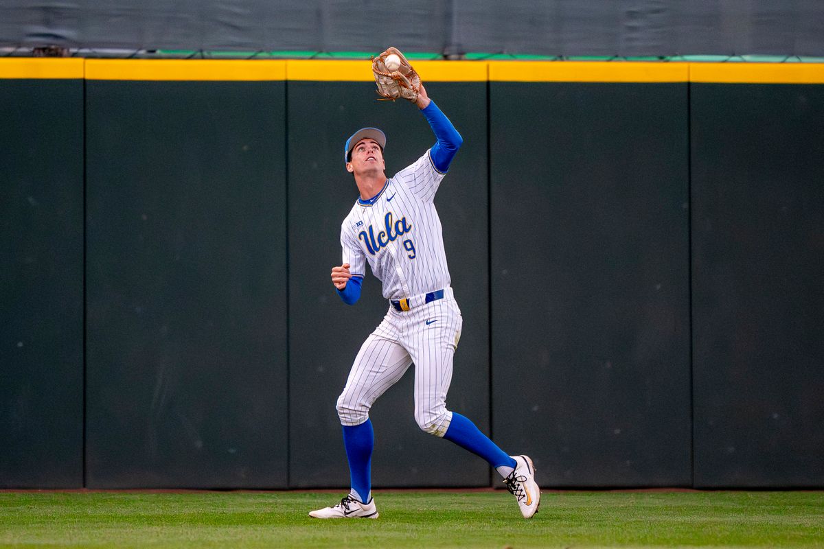 UCLA outfielder, Will Gasparino (9) catching a fly ball during a NCAA baseball game against UC San Diego on February 13, 2026 at Jackie Robinson Stadium in Los Angeles, CA.