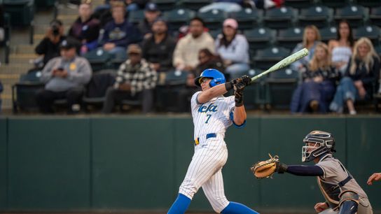 UCLA infielder, Roman Martin (7), at bat, mid-hit during a NCAA baseball game against UC San Diego on February 13, 2026 at Jackie Robinson Stadium in Los Angeles, CA.