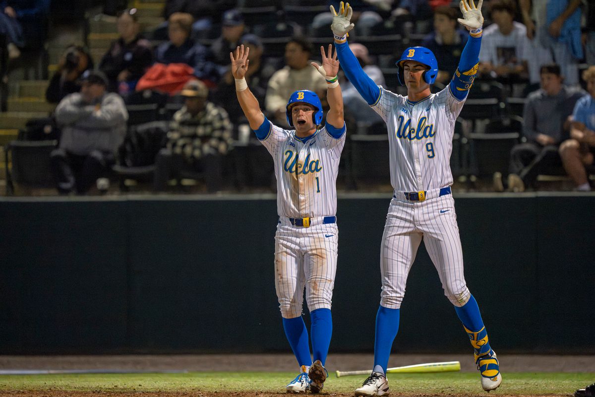 UCLA infielder and outfielder, Roch Cholowsky (1) and Will Gasparino (9), respectively, celebrating a double during a NCAA baseball game against UC San Diego on February 13, 2026 at Jackie Robinson Stadium in Los Angeles, CA.