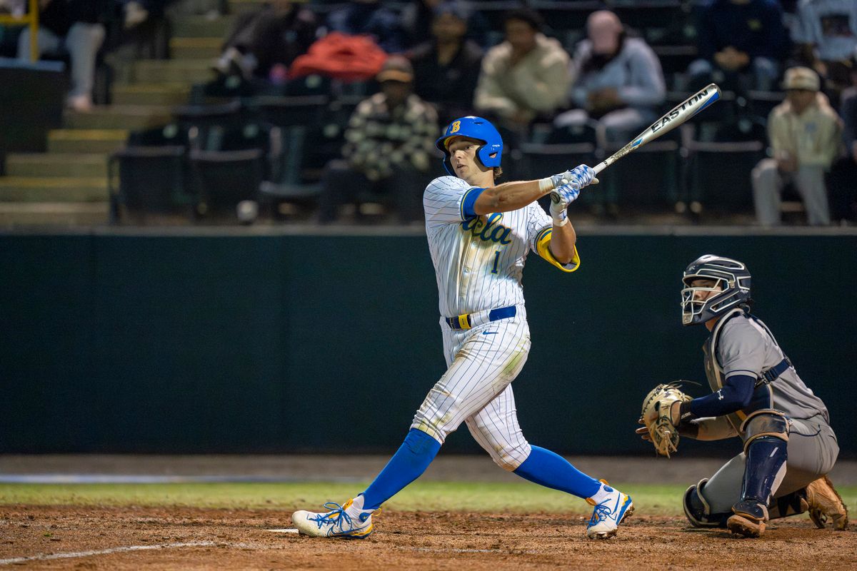 UCLA infielder, Roch Cholowsky (1), at bat, looking at his foul ball during a NCAA baseball game against UC San Diego on February 13, 2026 at Jackie Robinson Stadium in Los Angeles, CA.