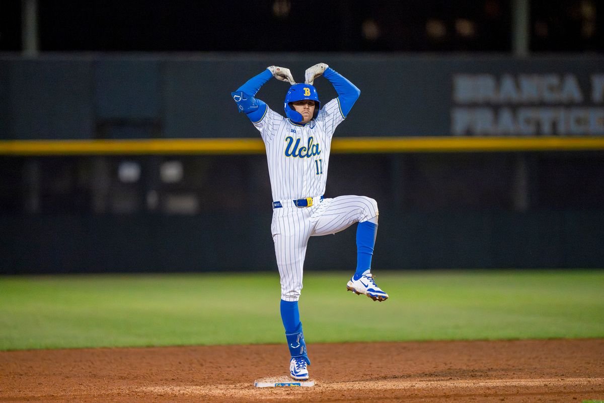 UCLA outfielder, Peyton Brennan (11) celebrating his double on second base during a NCAA baseball game against UC San Diego on February 13, 2026 at Jackie Robinson Stadium in Los Angeles, CA.