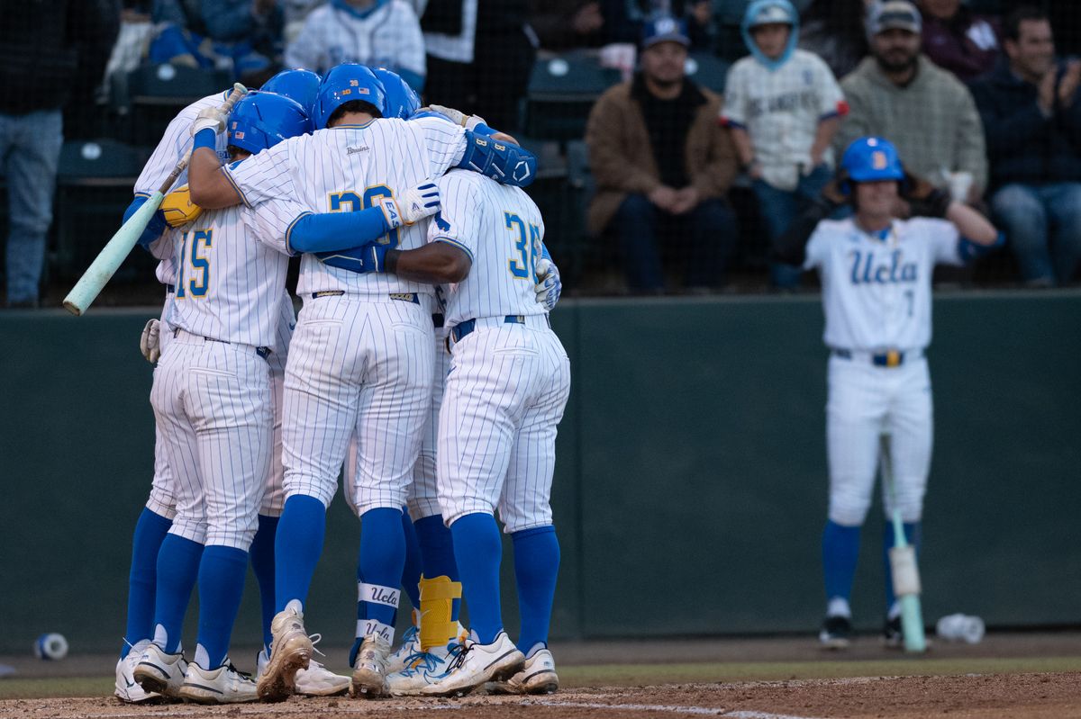 UCLA players huddle up and celebrate after hitting a homerun during a game between TCU and UCLA on Friday, February 20,2026 at Jackie Robinson Stadium in Los Angeles Calif