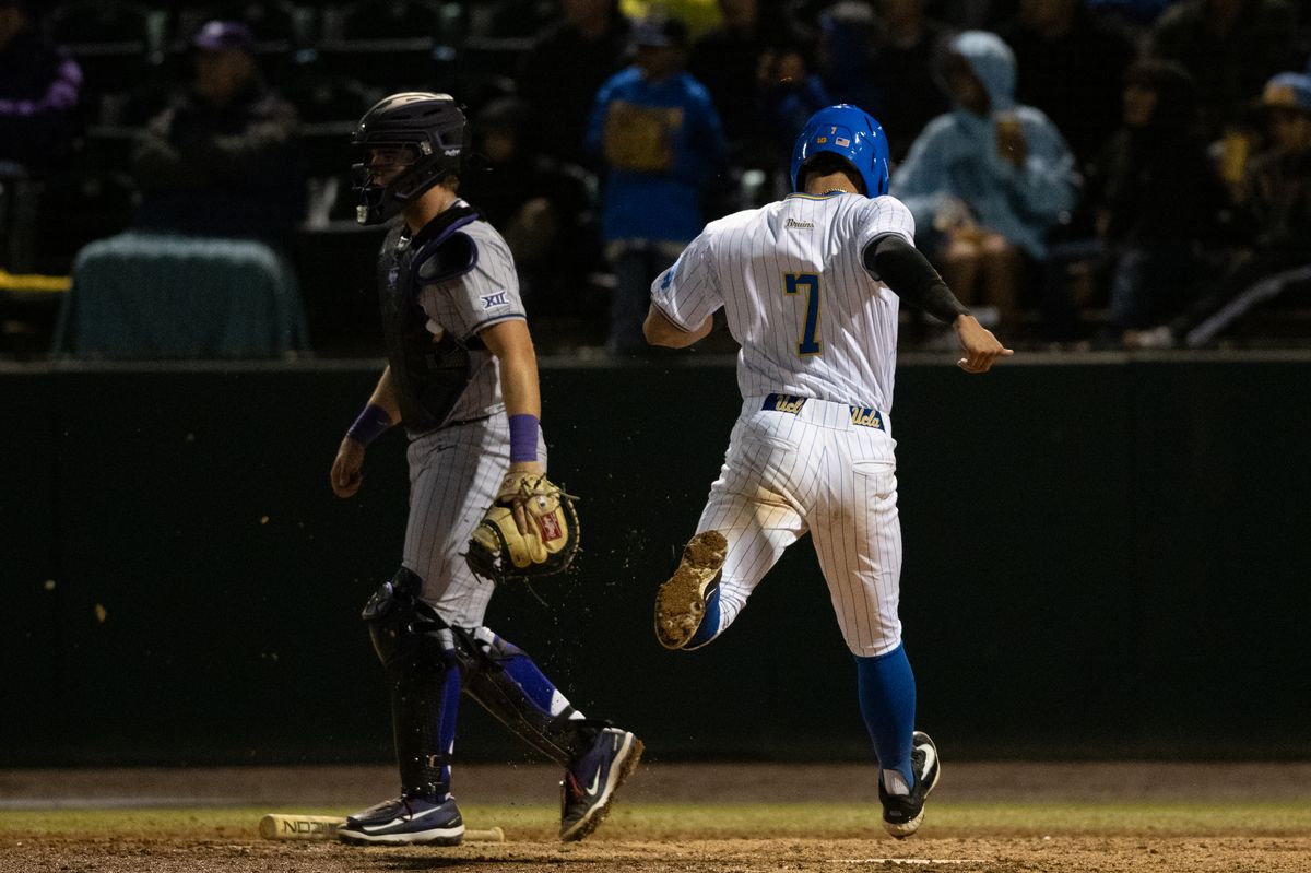 UCLA third baseman Roman Martin (7) touches home plate during a game between TCU and UCLA on Friday, February 20,2026 at Jackie Robinson Stadium in Los Angeles Calif