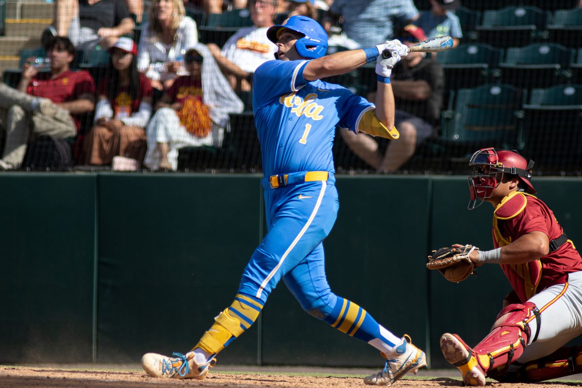UCLA infielder, Roch Cholowsky (1) at bat, mid hit during an NCAA baseball game against USC on April 4th, 2026 at Jackie Robinson Stadium in Los Angeles, CA.