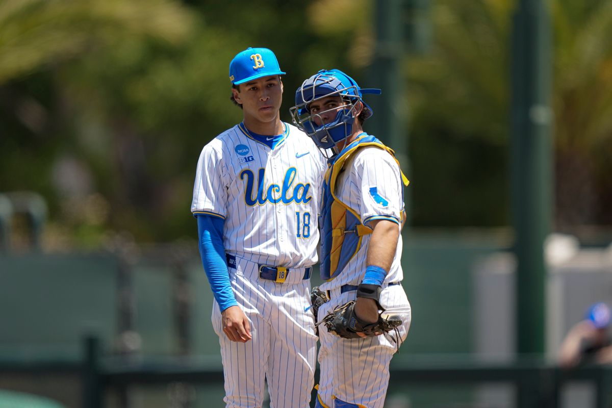 UCLA pitcher Wylan Moss (18) meeting with catcher Cashel Dugger (40) on the mound during a NCAA baseball game against Saint Mary’s on May 29, 2026 at Jackie Robinson Stadium in Los Angeles, CA. UCLA pitcher Wylan Moss (18) meeting with catcher Cashel Dugger (40) on the mound during a NCAA baseball game against Saint Mary’s on May 29, 2026 at Jackie Robinson Stadium in Los Angeles, CA.