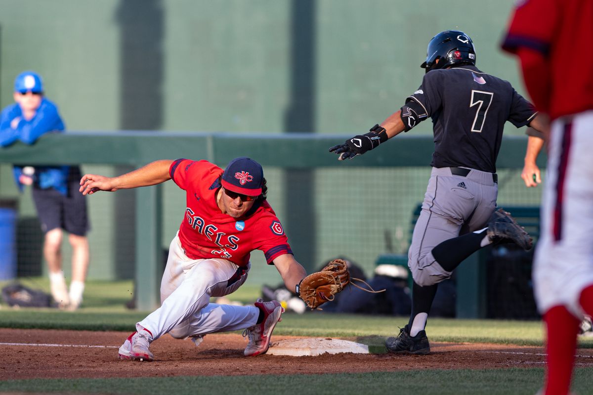 Saint Mary's College infielder Makoa Sniffen (23) catches the ball at first base for an out during an NCAA regional championship elimination game between the Saint Mary's College Gaels and Cal Poly Mustangs on May 31, 2026 at Jackie Robinson Stadium in Los Angeles Calif.