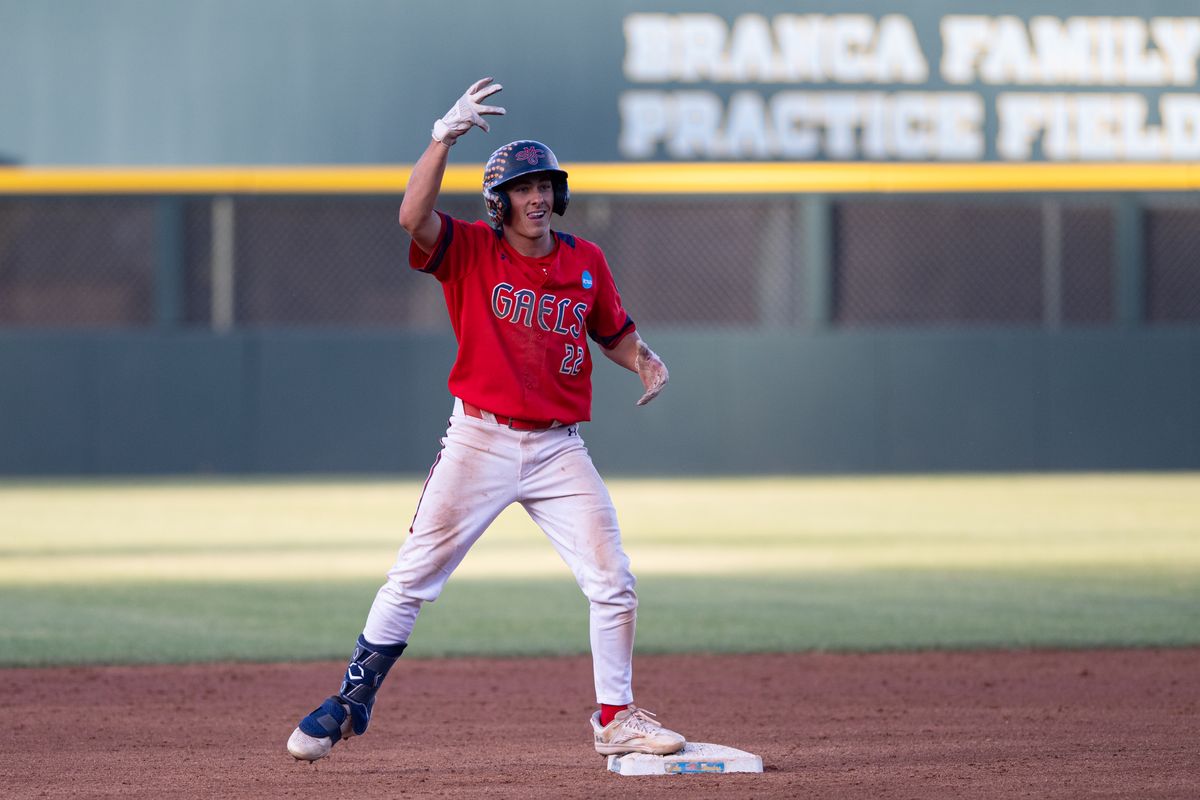 Saint Mary's College outfielder Tanner Griffith (22) gestures to the dugout after making it to second base during an NCAA regional championship elimination game between the Saint Mary's College Gaels and Cal Poly Mustangs on May 31, 2026 at Jackie Robinson Stadium in Los Angeles Calif.