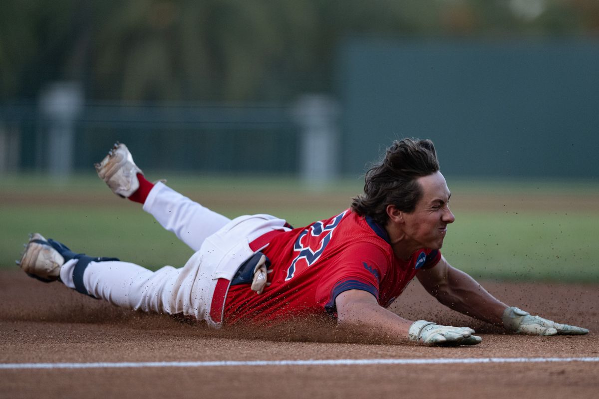 Saint Mary's College outfielder Tanner Griffith (22) dives into third base during an NCAA regional championship elimination game between the Saint Mary's College Gaels and Cal Poly Mustangs on May 31, 2026 at Jackie Robinson Stadium in Los Angeles Calif.